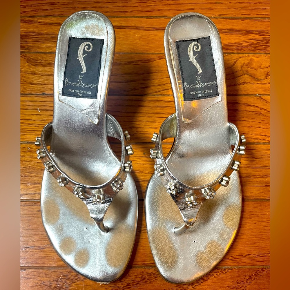 Silver sandals with rhinestones.